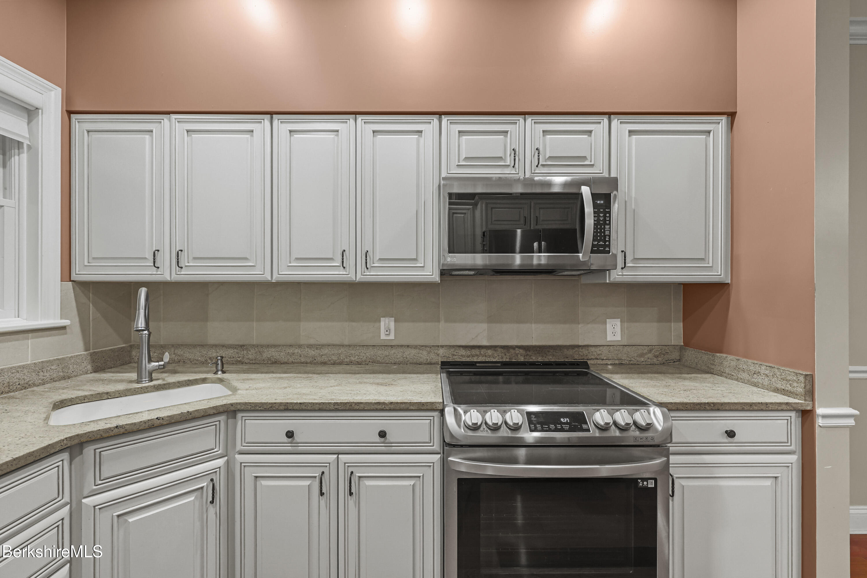2 Amy Court, Unit 2 Pittsfield, MA 01201 - Photo 14 of 50 a kitchen with granite countertop white cabinets and stainless steel appliances