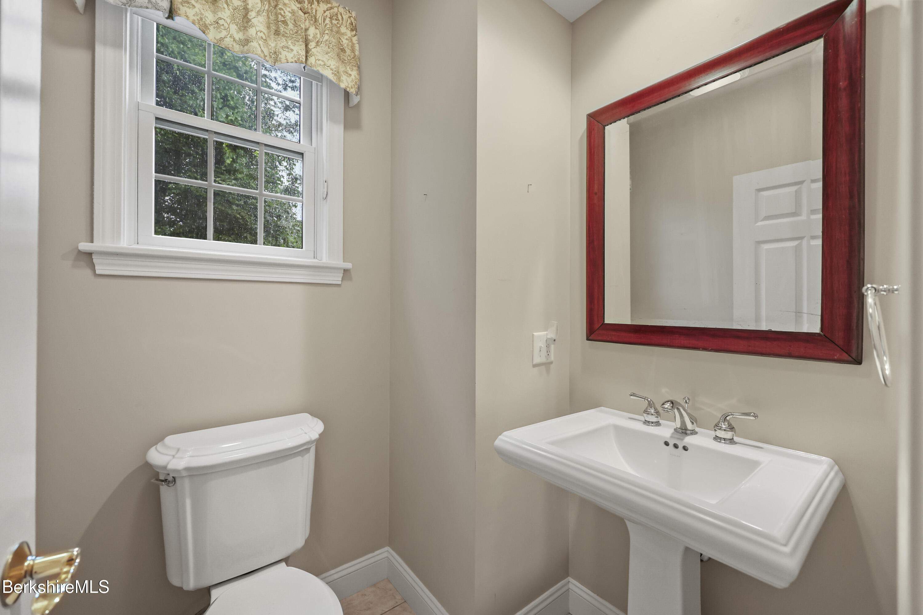 2 Amy Court, Unit 2 Pittsfield, MA 01201 - Photo 26 of 50 a bathroom with a toilet a sink and a mirror