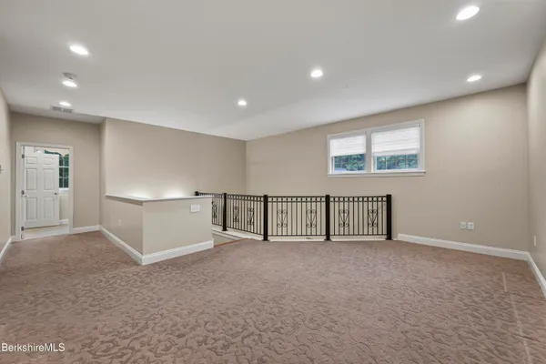 a view of an empty room with windows