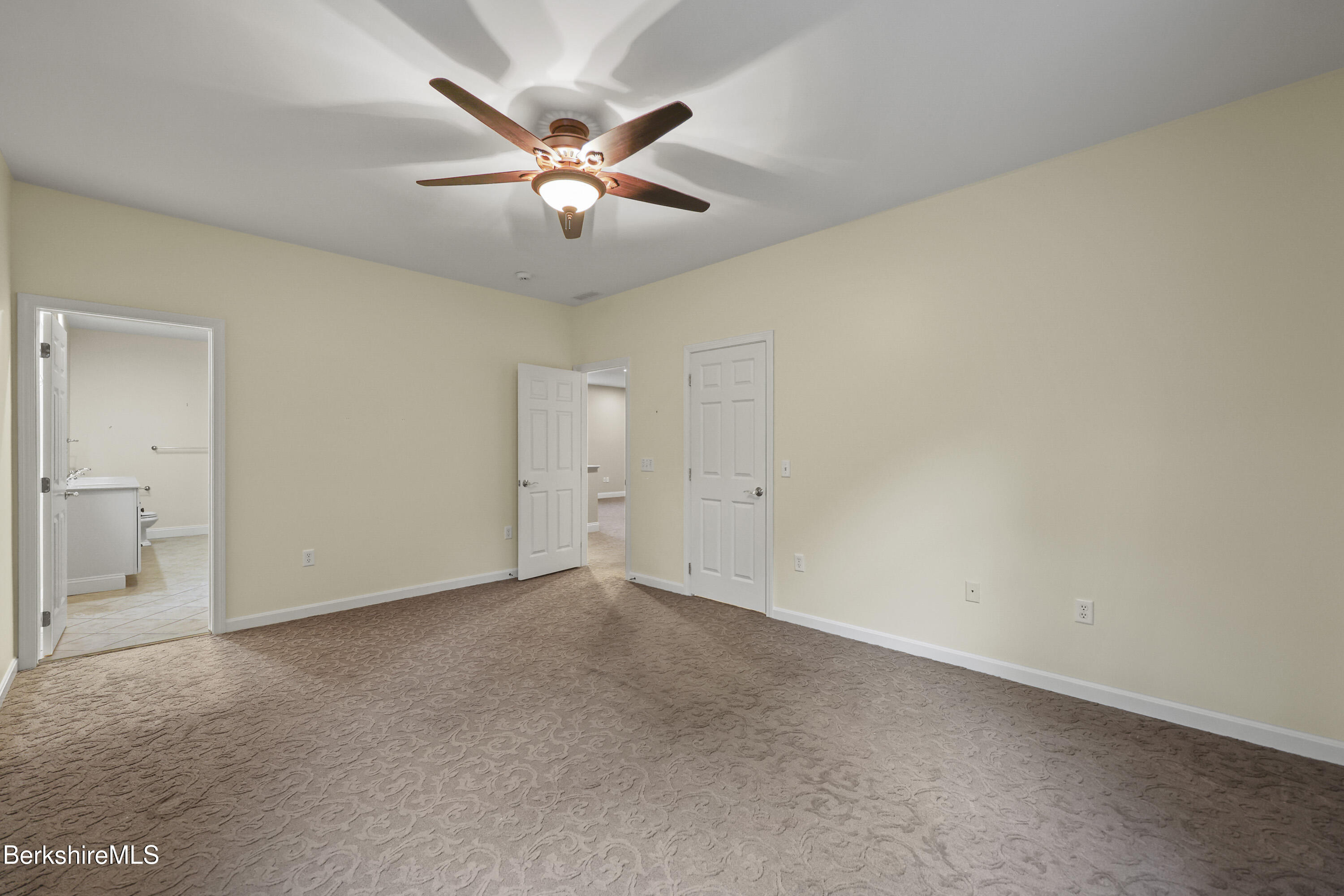 2 Amy Court, Unit 2 Pittsfield, MA 01201 - Photo 31 of 50 an empty room with windows and fan