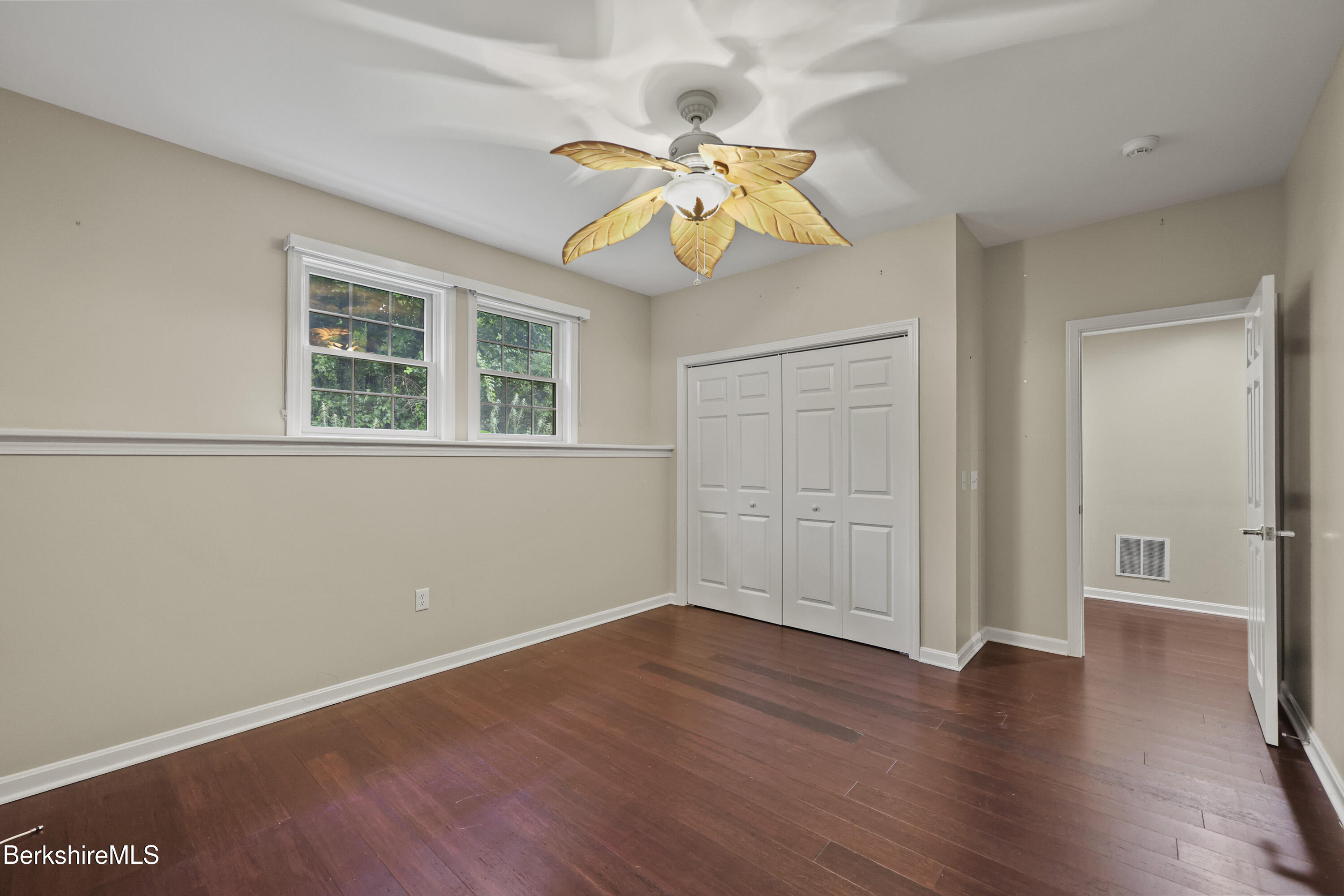 2 Amy Court, Unit 2 Pittsfield, MA 01201 - Photo 45 of 50 an empty room with wooden floor closet and windows