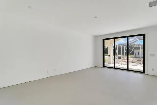 a view of an empty room with a sliding door