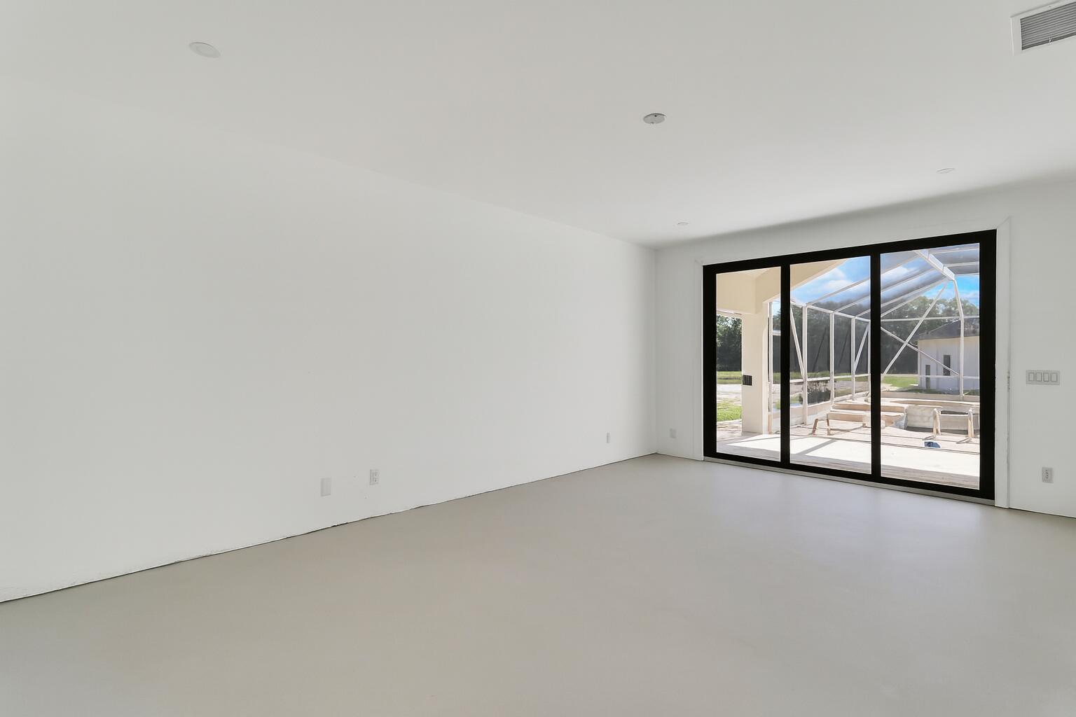 18851 Mack Dairy Road Jupiter, FL 33478 - Photo 20 of 47 a view of an empty room with a sliding door