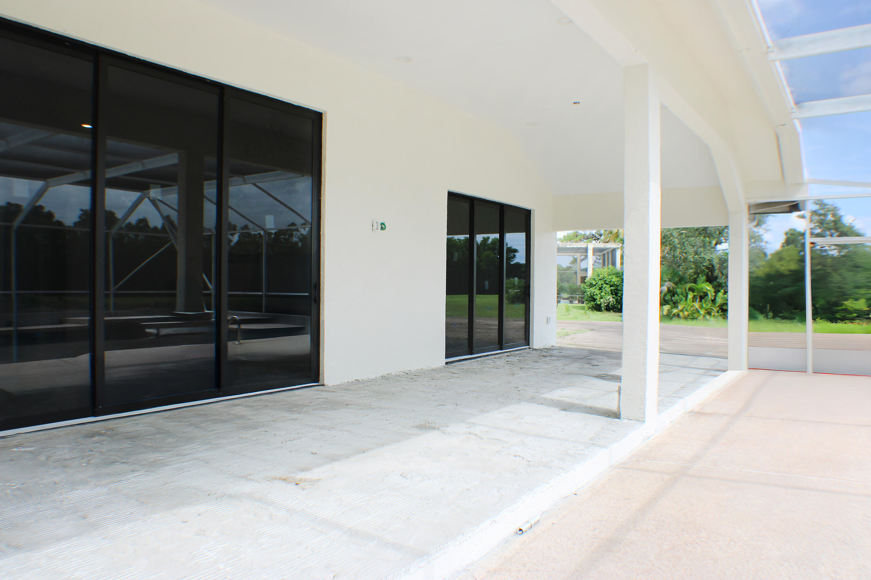 18851 Mack Dairy Road Jupiter, FL 33478 - Photo 23 of 47 a view of an empty room with glass door