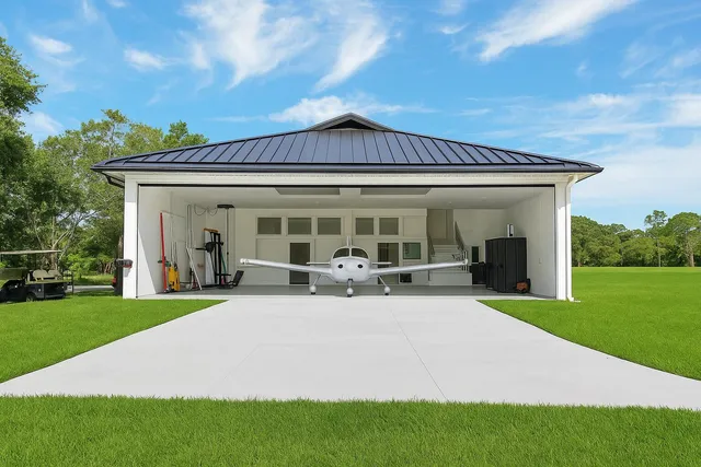 a front view of a house with garden and porch