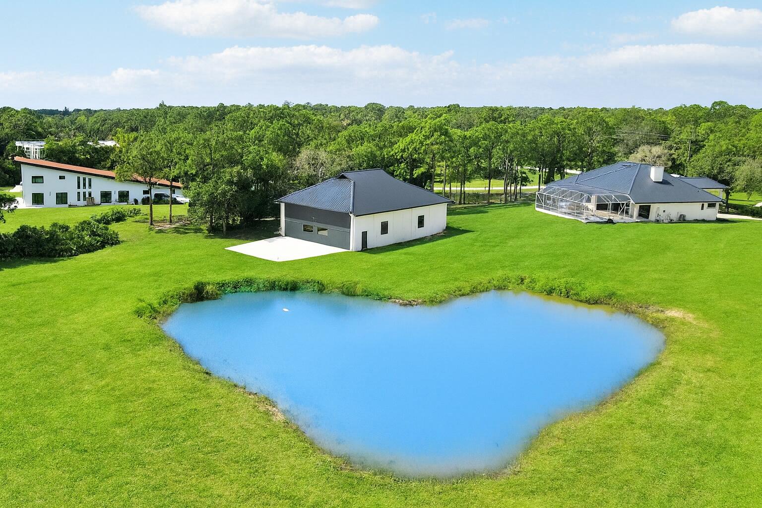 18851 Mack Dairy Road Jupiter, FL 33478 - Photo 45 of 47 a view of a house with a big yard