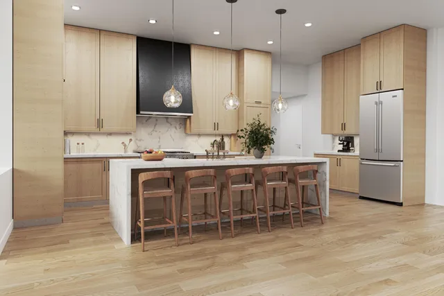 a kitchen with kitchen island granite countertop wooden cabinets and a refrigerator