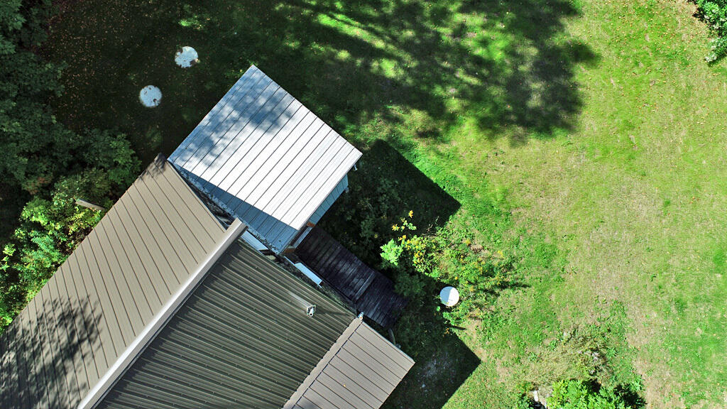 614 Shin Pond Road Patten, ME 04765 - Photo 21 of 51 metal-roof-entry-mud-room