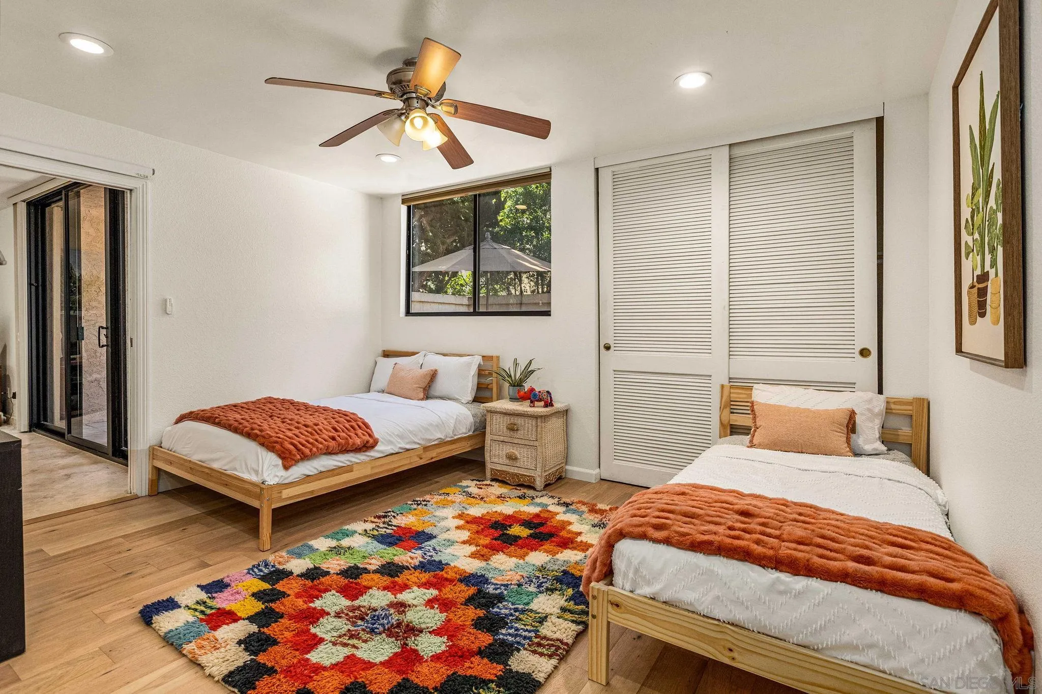 2420 Torrey Pines Road, Unit A104 La Jolla, CA 92037 - Photo 13 of 23 a bedroom with a bed and a chandelier