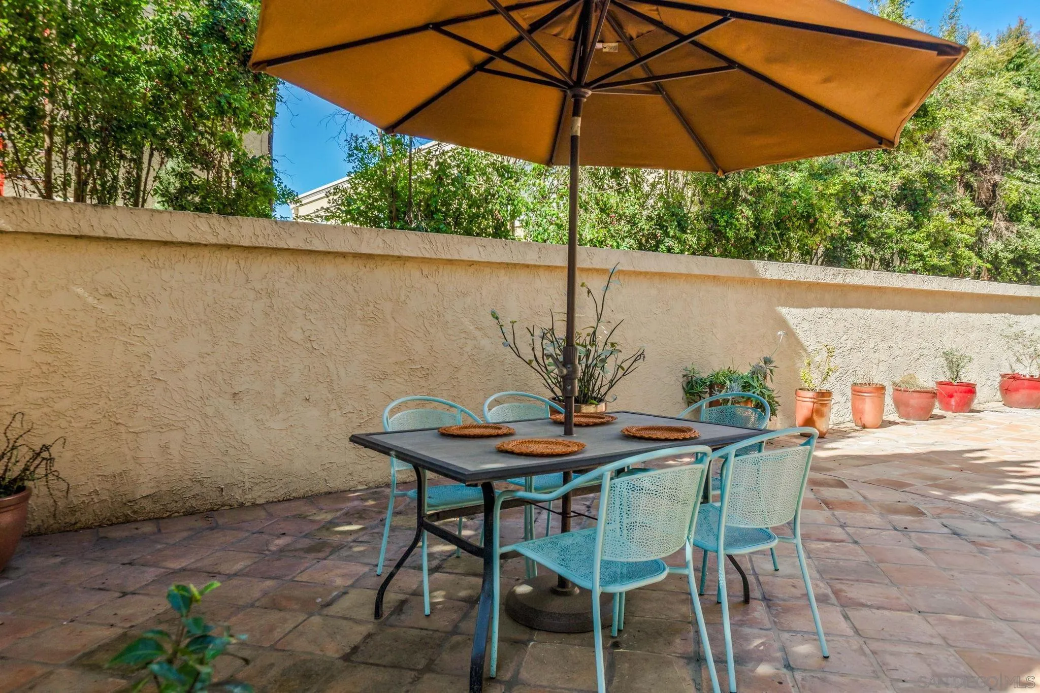 2420 Torrey Pines Road, Unit A104 La Jolla, CA 92037 - Photo 22 of 23 a view of an outdoor space with furniture and umbrella