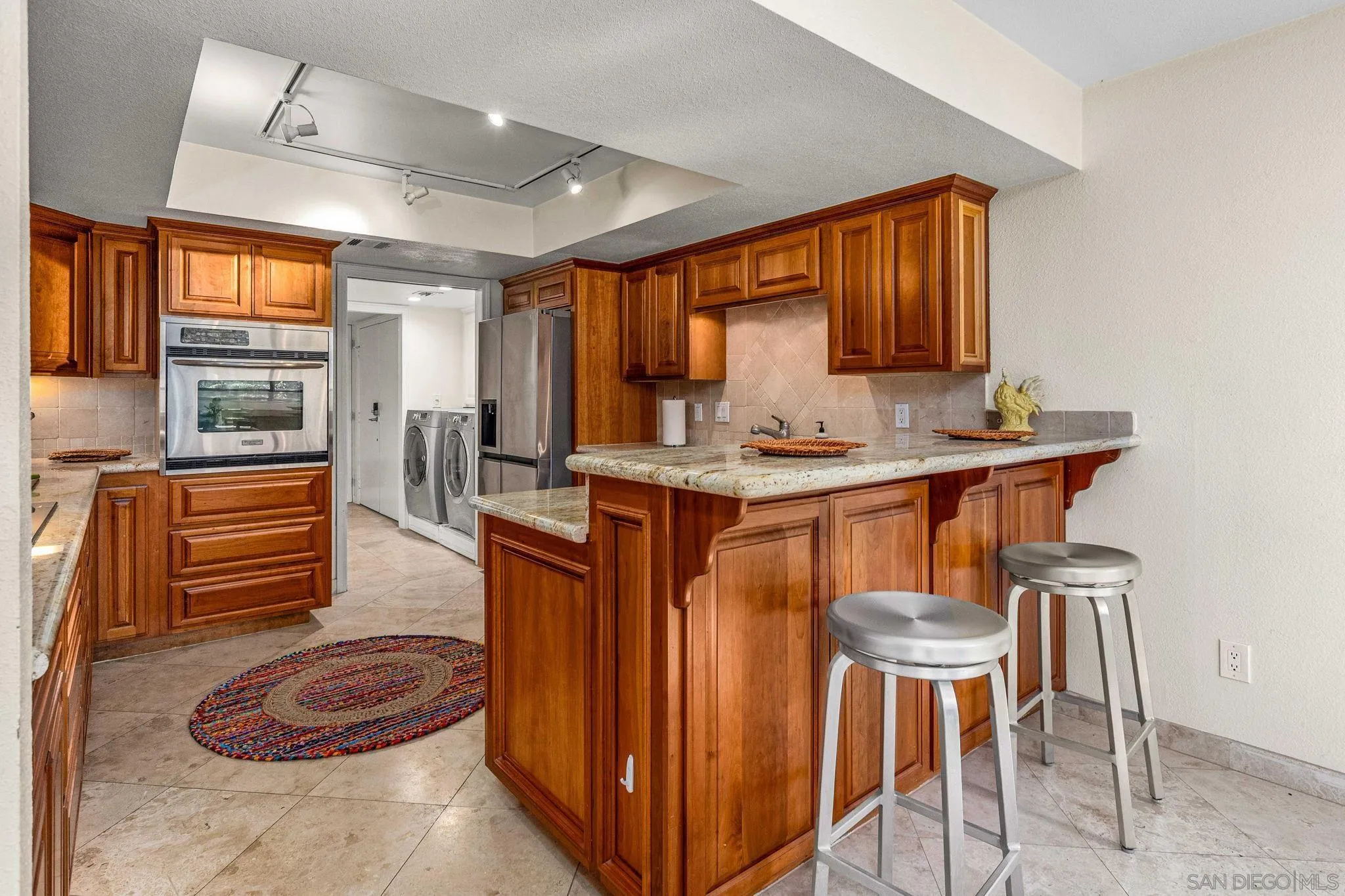 2420 Torrey Pines Road, Unit A104 La Jolla, CA 92037 - Photo 4 of 23 a dining room with furniture and window