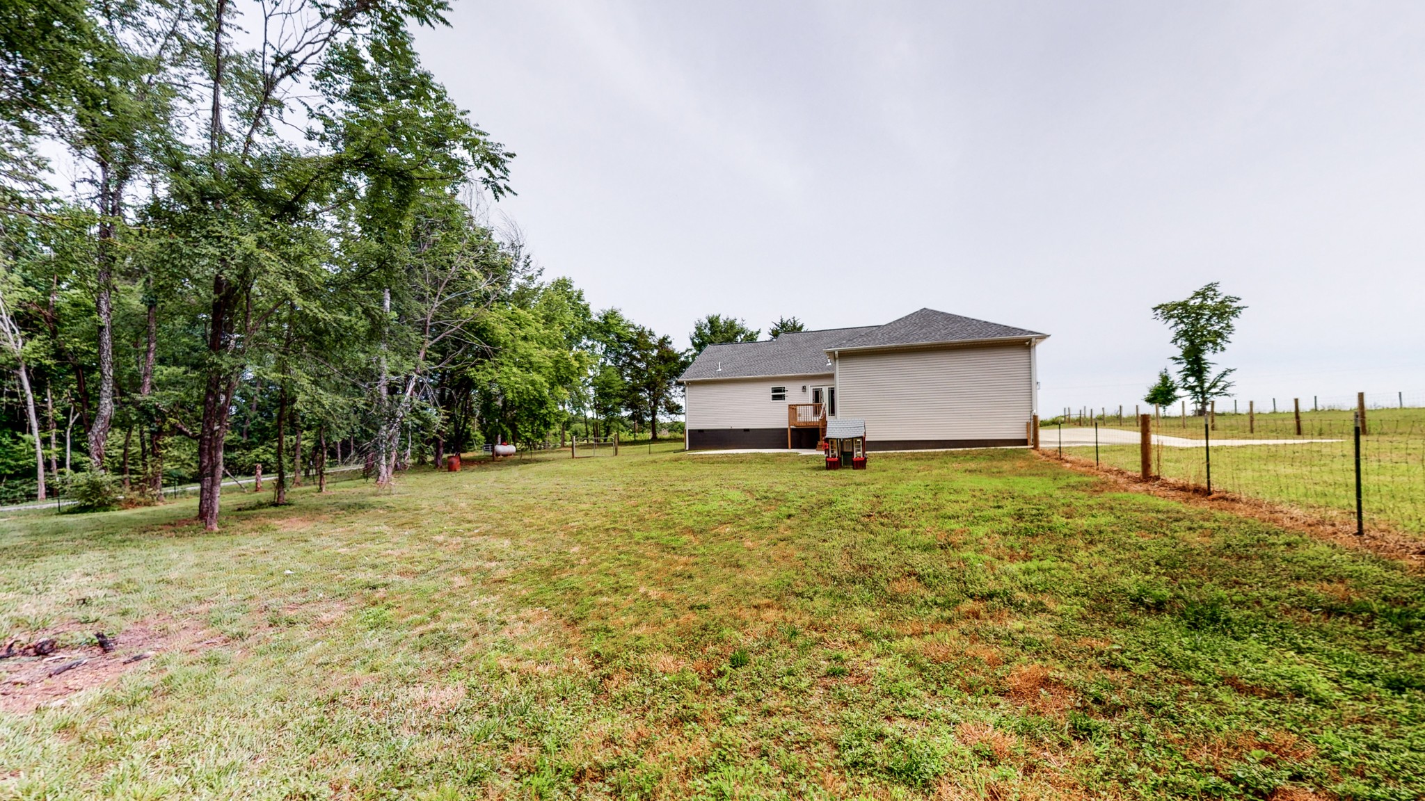142 Philpot Road Ardmore, TN 38449 - Photo 15 of 51 a house with trees in front of it