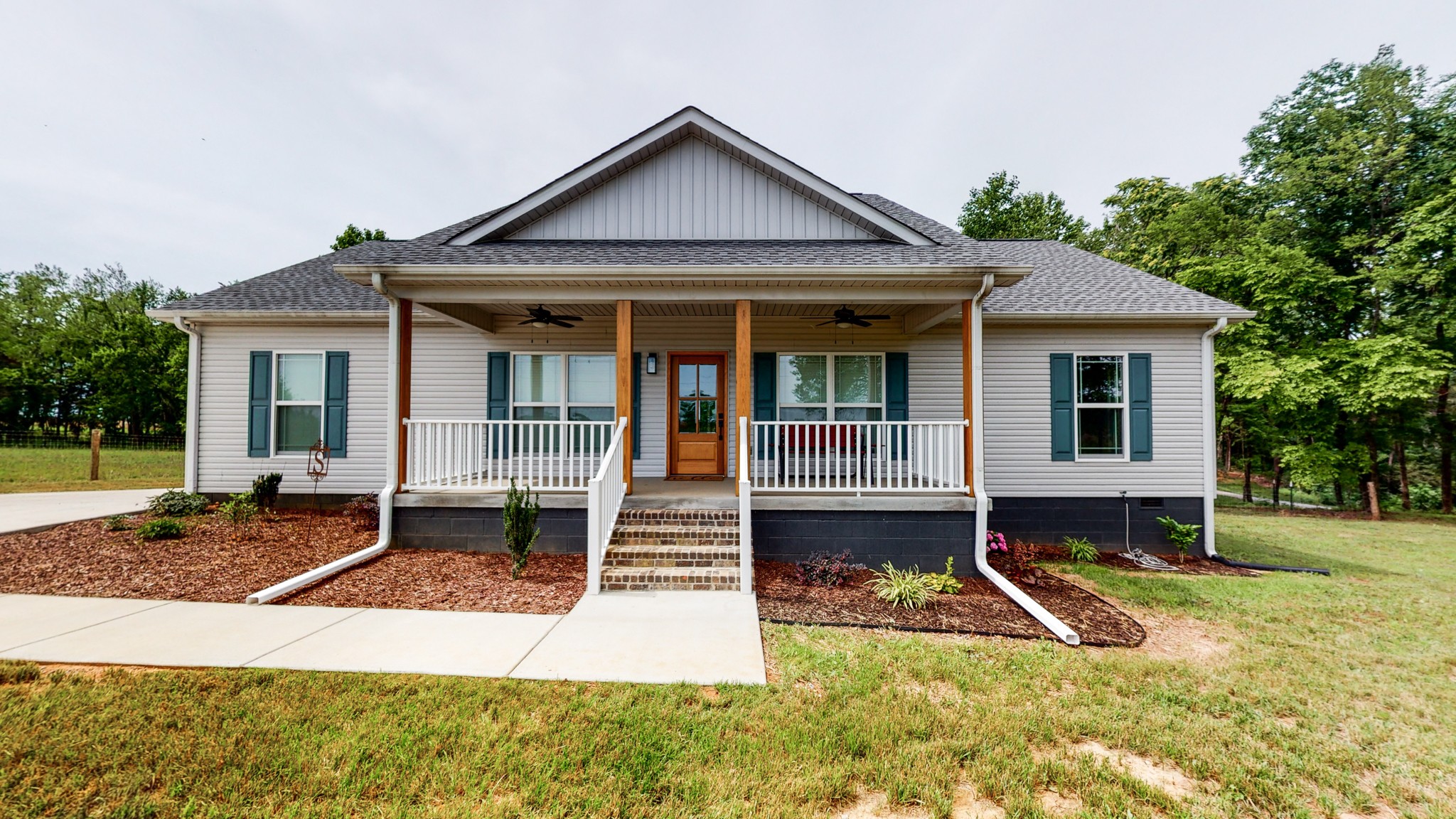 142 Philpot Road Ardmore, TN 38449 - Photo 2 of 51 a view of a house with backyard porch and sitting area