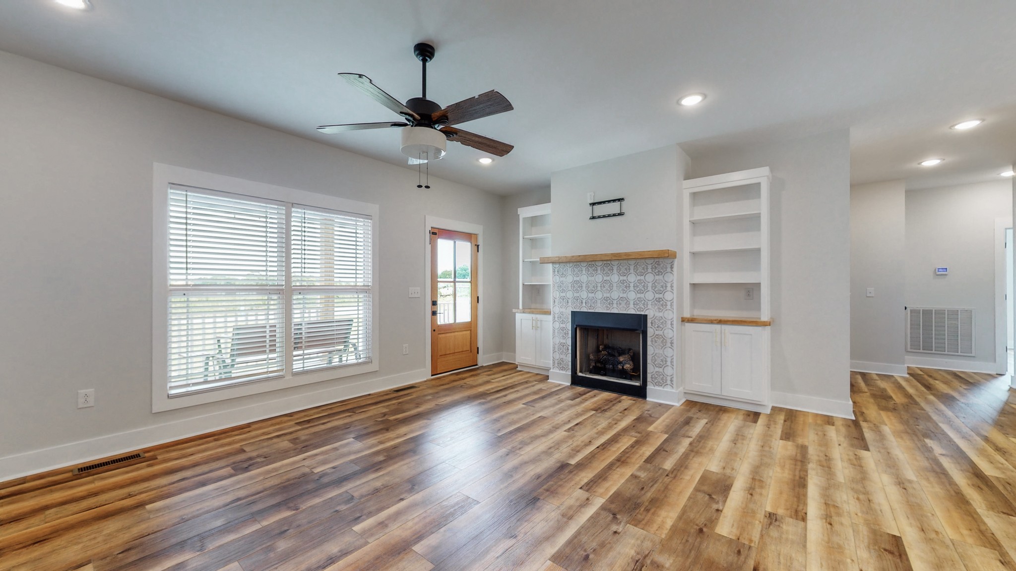 142 Philpot Road Ardmore, TN 38449 - Photo 22 of 51 a view of an empty room with a fireplace and a window
