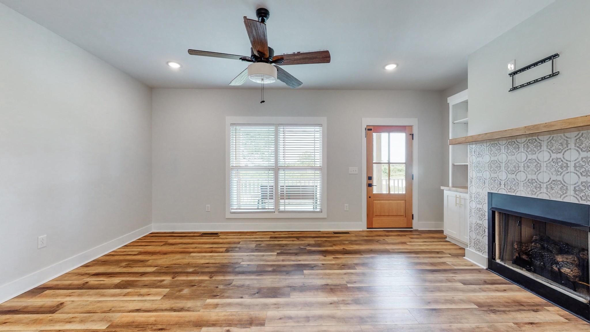 142 Philpot Road Ardmore, TN 38449 - Photo 23 of 51 a view of empty room with wooden floor and fireplace