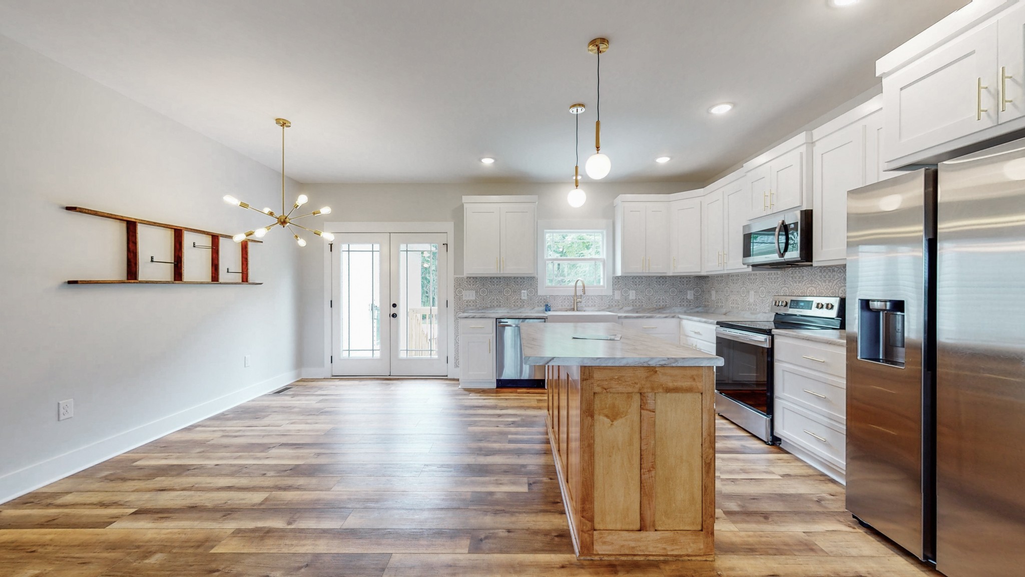 142 Philpot Road Ardmore, TN 38449 - Photo 24 of 51 a large kitchen with cabinets and stainless steel appliances
