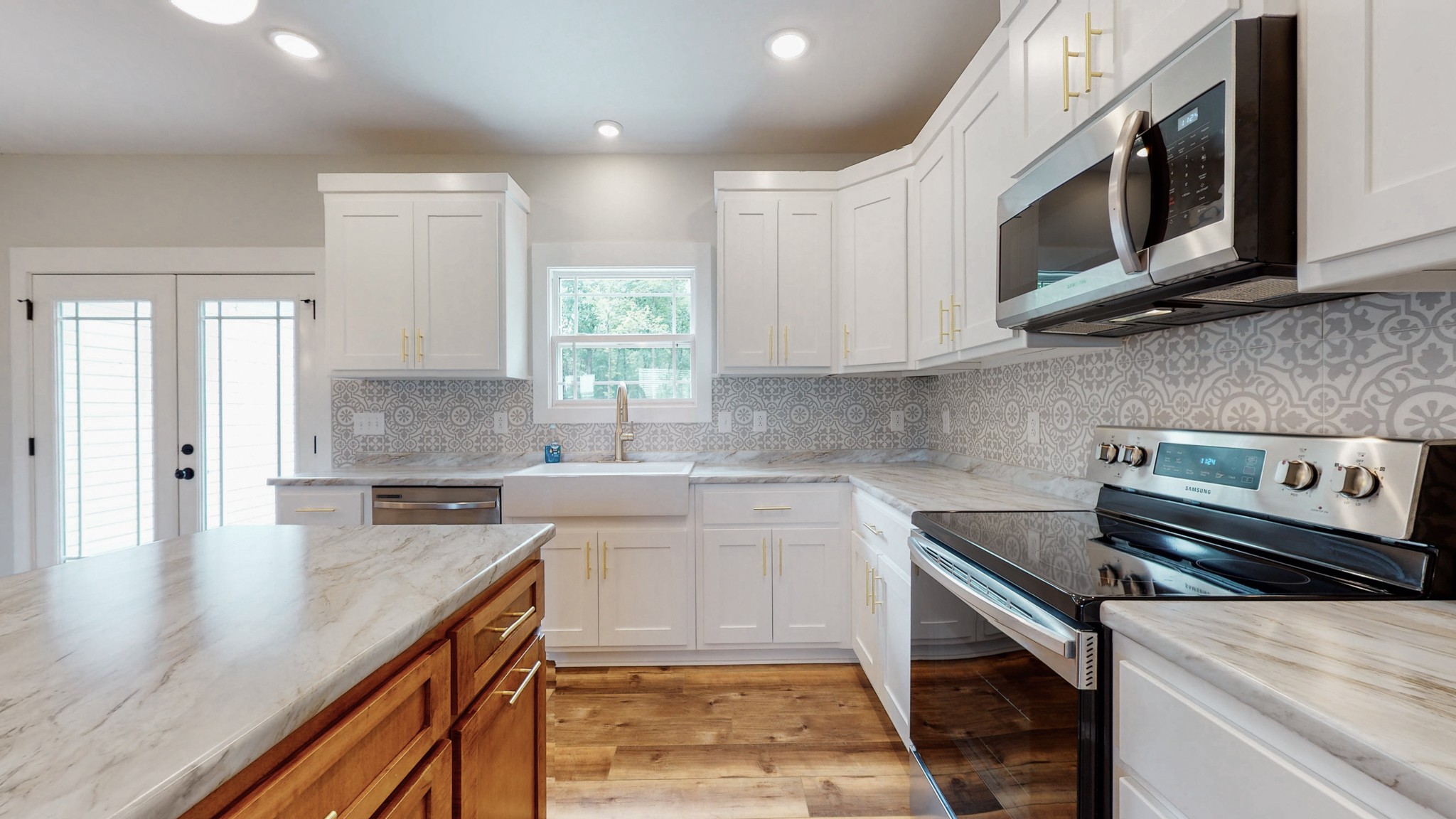 142 Philpot Road Ardmore, TN 38449 - Photo 26 of 51 a kitchen with stainless steel appliances granite countertop a sink stove and microwave