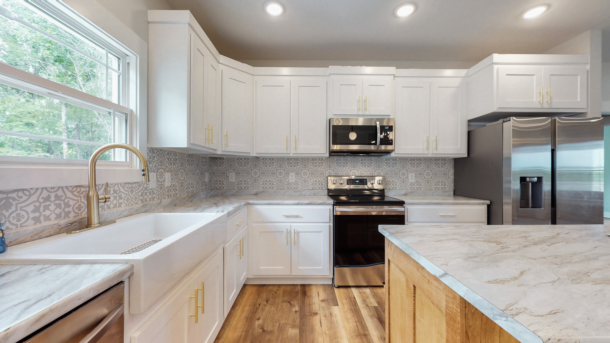 142 Philpot Road Ardmore, TN 38449 - Photo 28 of 51 a kitchen with kitchen island a sink stove and refrigerator