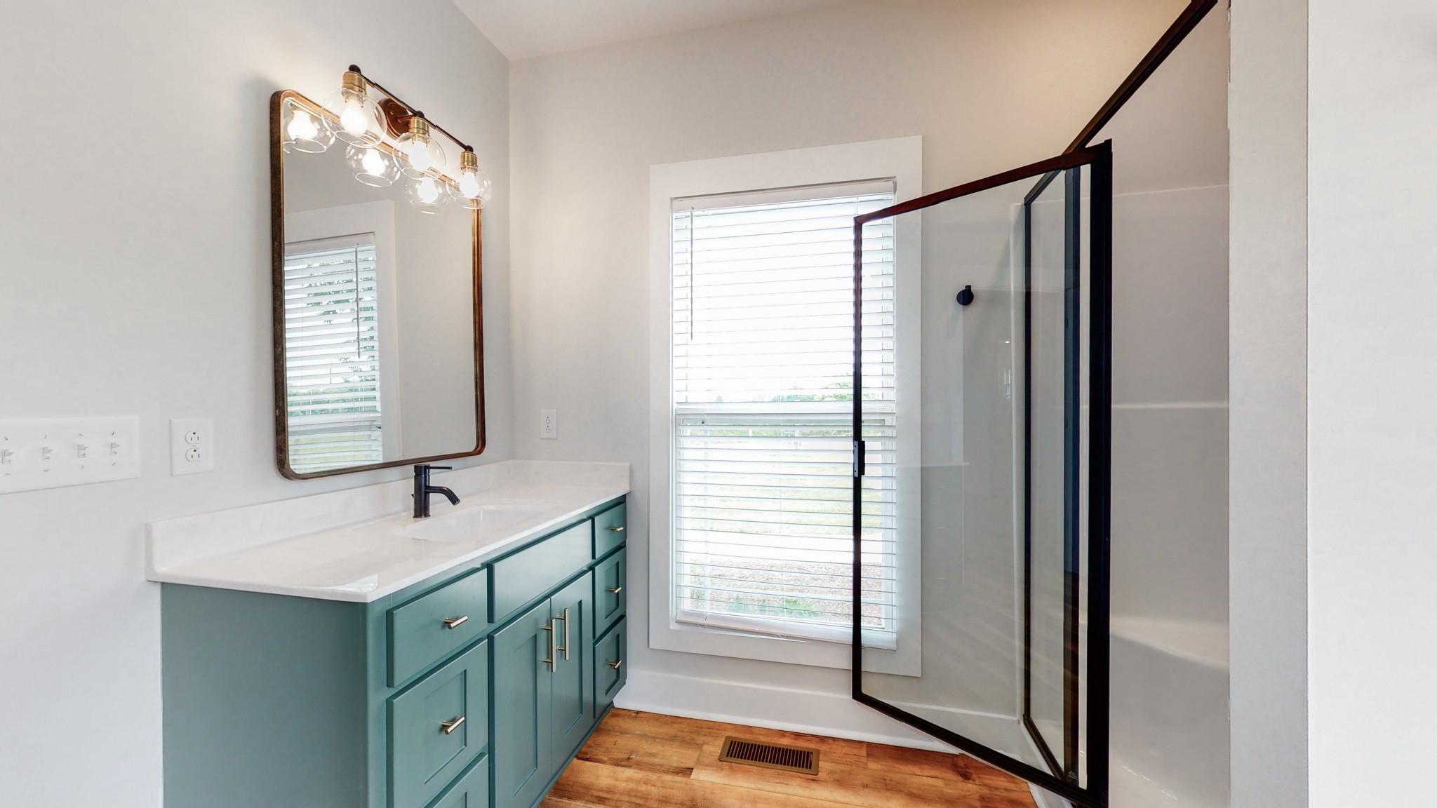 142 Philpot Road Ardmore, TN 38449 - Photo 35 of 51 a bathroom with a sink a mirror and a shower