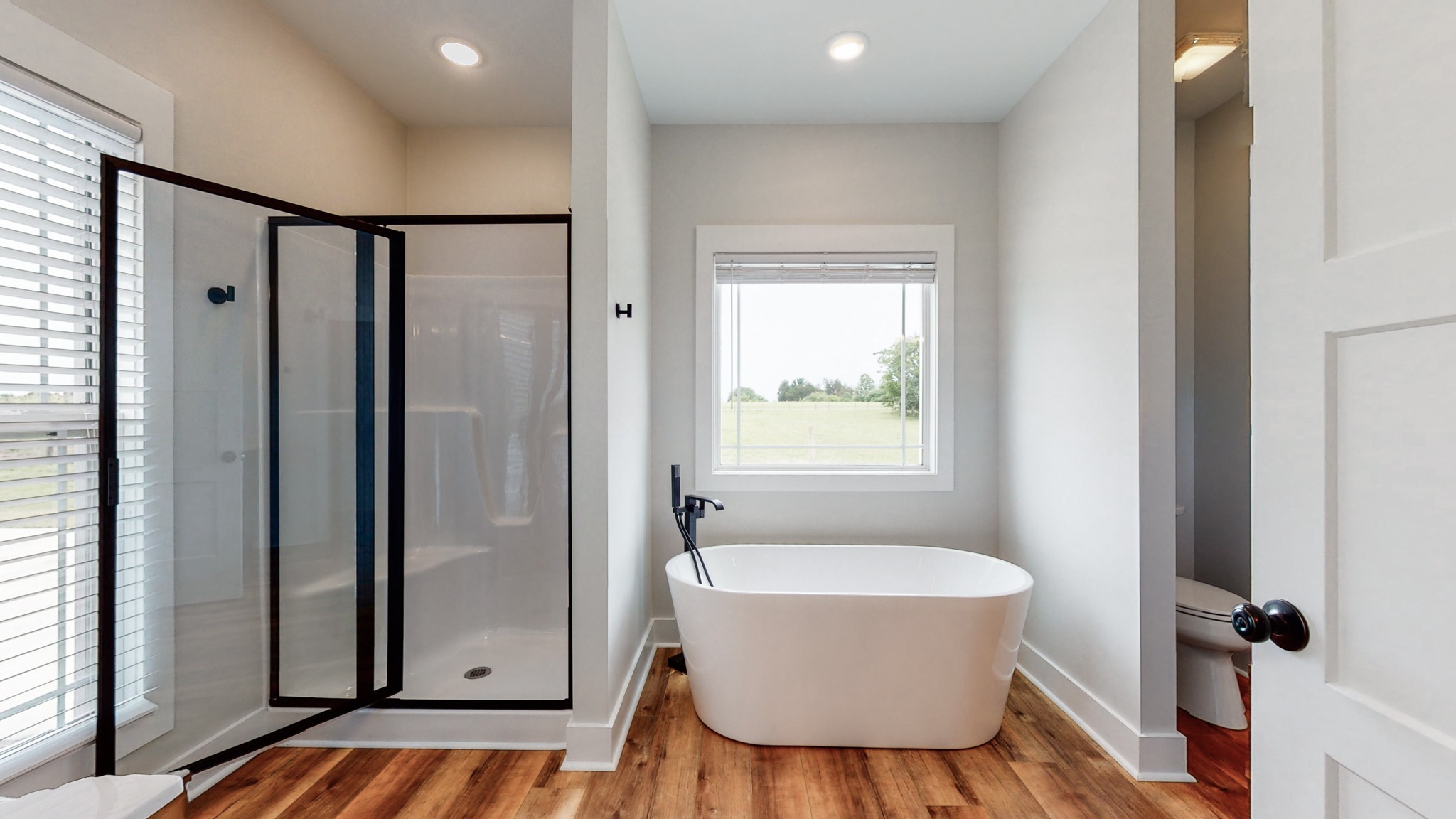 142 Philpot Road Ardmore, TN 38449 - Photo 36 of 51 a bathroom with a bathtub and shower