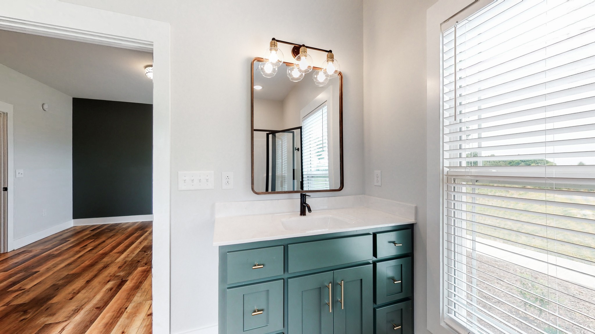 142 Philpot Road Ardmore, TN 38449 - Photo 37 of 51 a bathroom with a sink a mirror and vanity