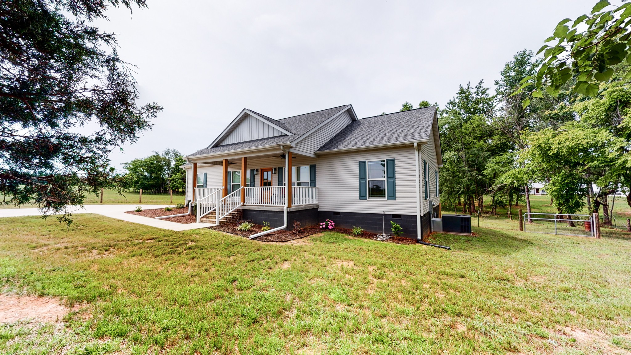 142 Philpot Road Ardmore, TN 38449 - Photo 4 of 51 a view of a house with a yard patio and a tree