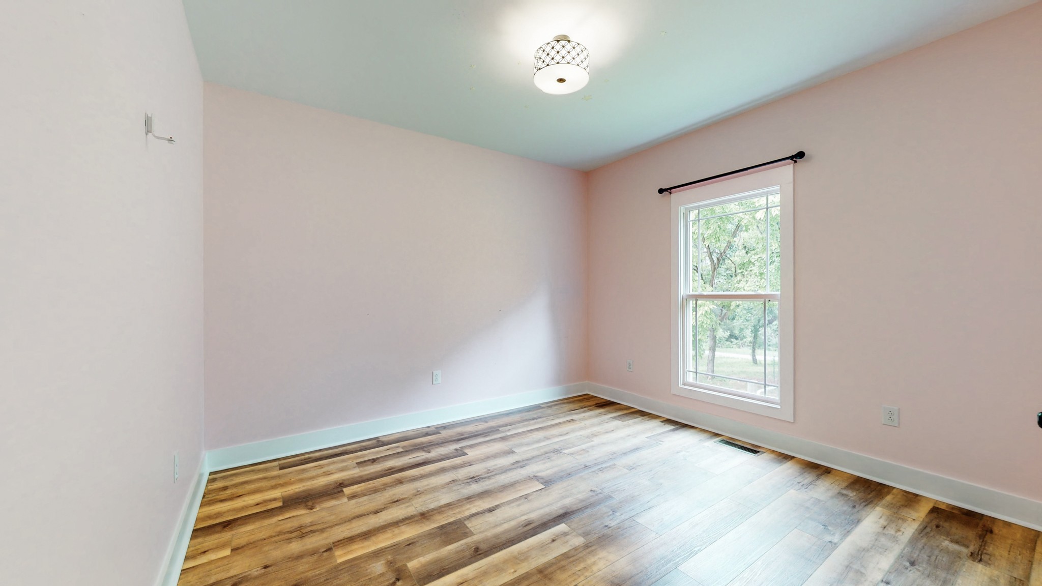 142 Philpot Road Ardmore, TN 38449 - Photo 42 of 51 an empty room with wooden floor and windows