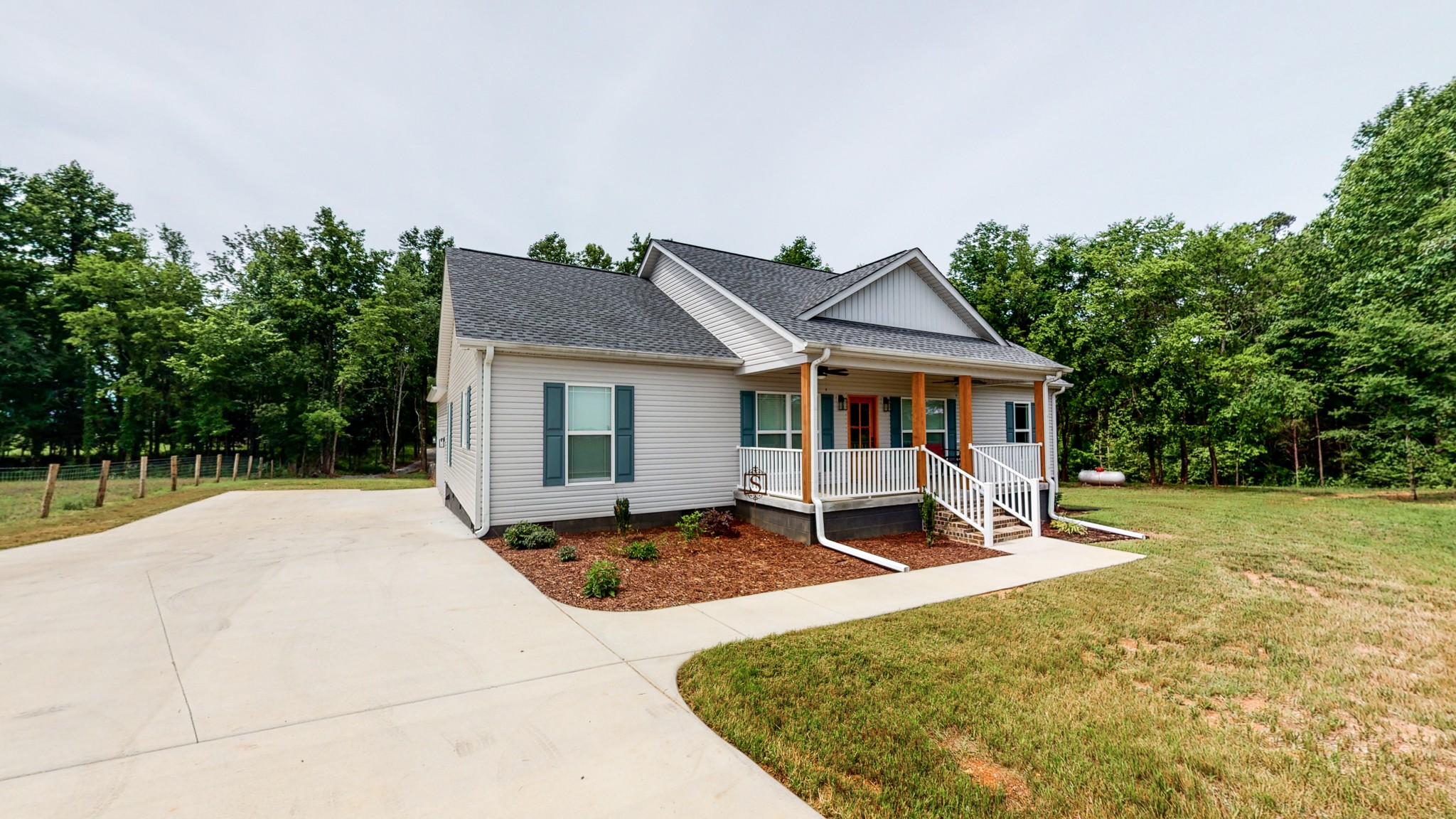 142 Philpot Road Ardmore, TN 38449 - Photo 6 of 51 a front view of a house with a yard outdoor seating and barbeque oven