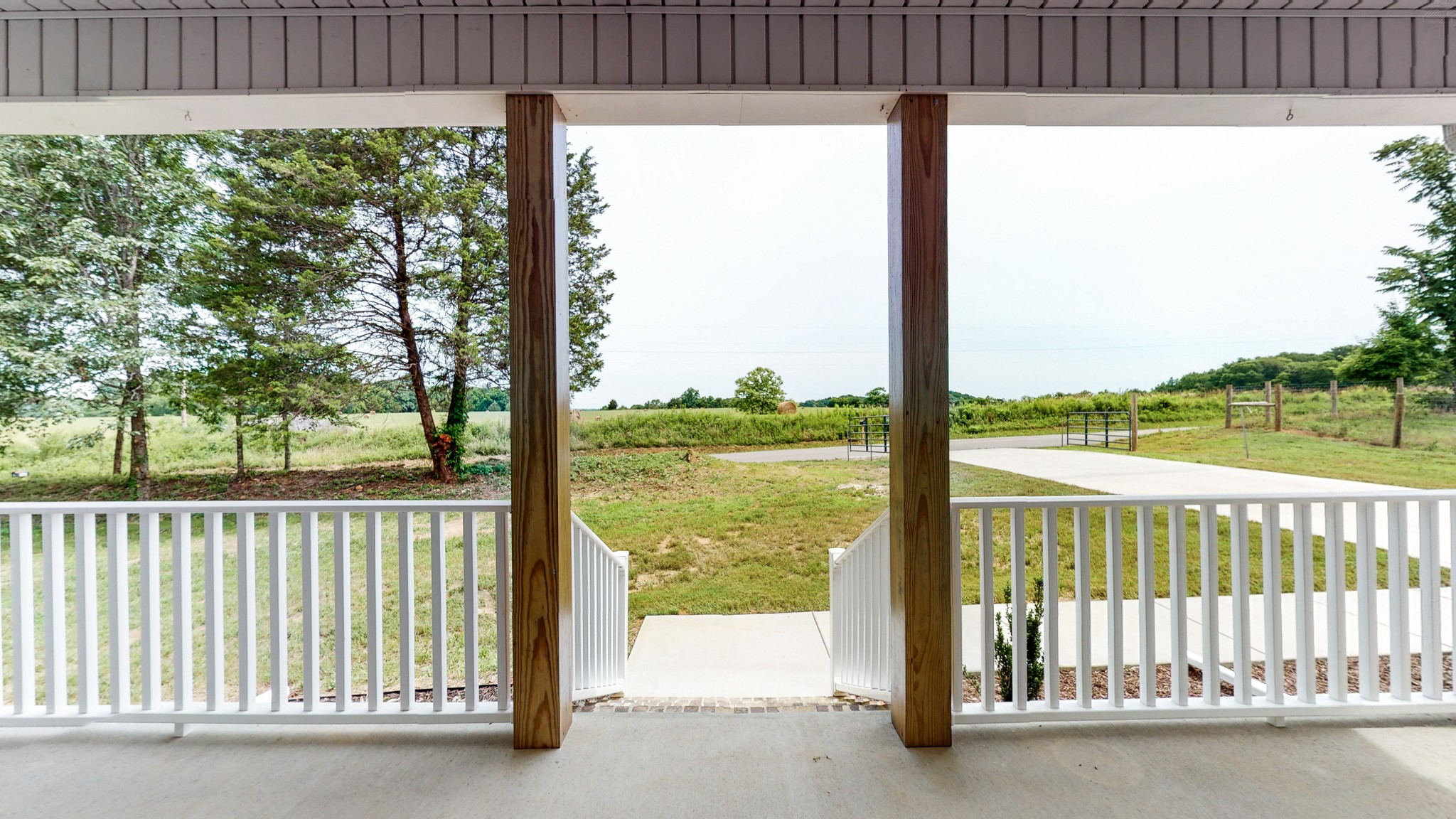 142 Philpot Road Ardmore, TN 38449 - Photo 7 of 51 a view of a porch with a floor to ceiling window next to a yard