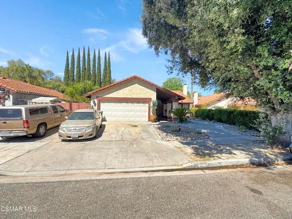 a view of a car in front of a house