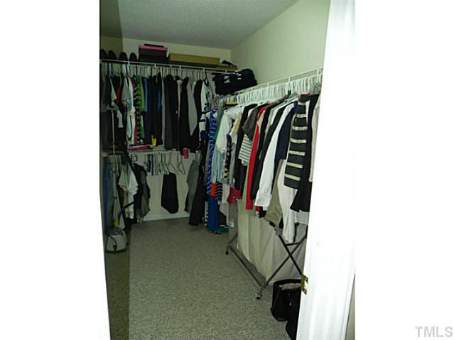 4517 Whistling Way Raleigh, NC 27616 - Photo 14 of 24 a view of walk in closet with clothes