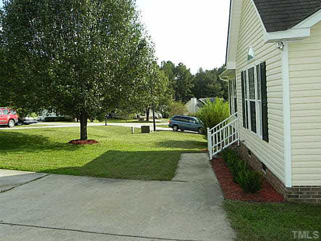 4517 Whistling Way Raleigh, NC 27616 - Photo 3 of 24 a view of garden with patio