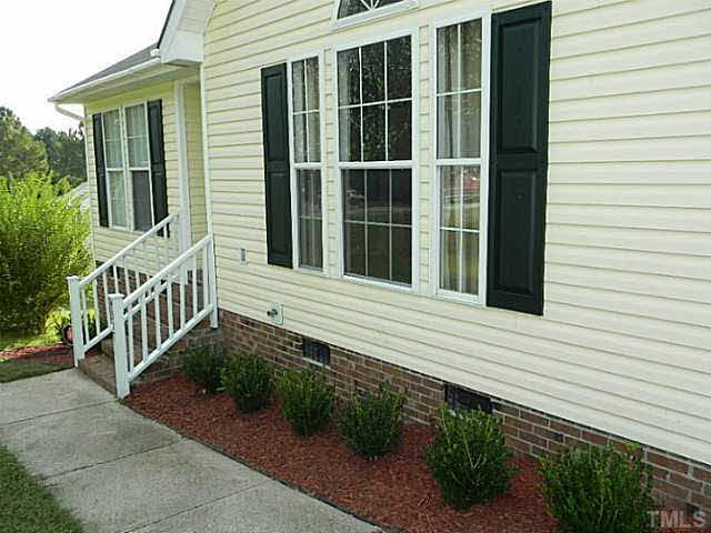 4517 Whistling Way Raleigh, NC 27616 - Photo 4 of 24 a house with a window and garden