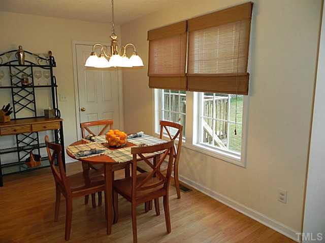 4517 Whistling Way Raleigh, NC 27616 - Photo 8 of 24 a dining room with furniture and window
