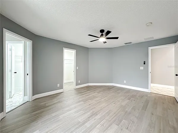 a view of a bedroom with a bed