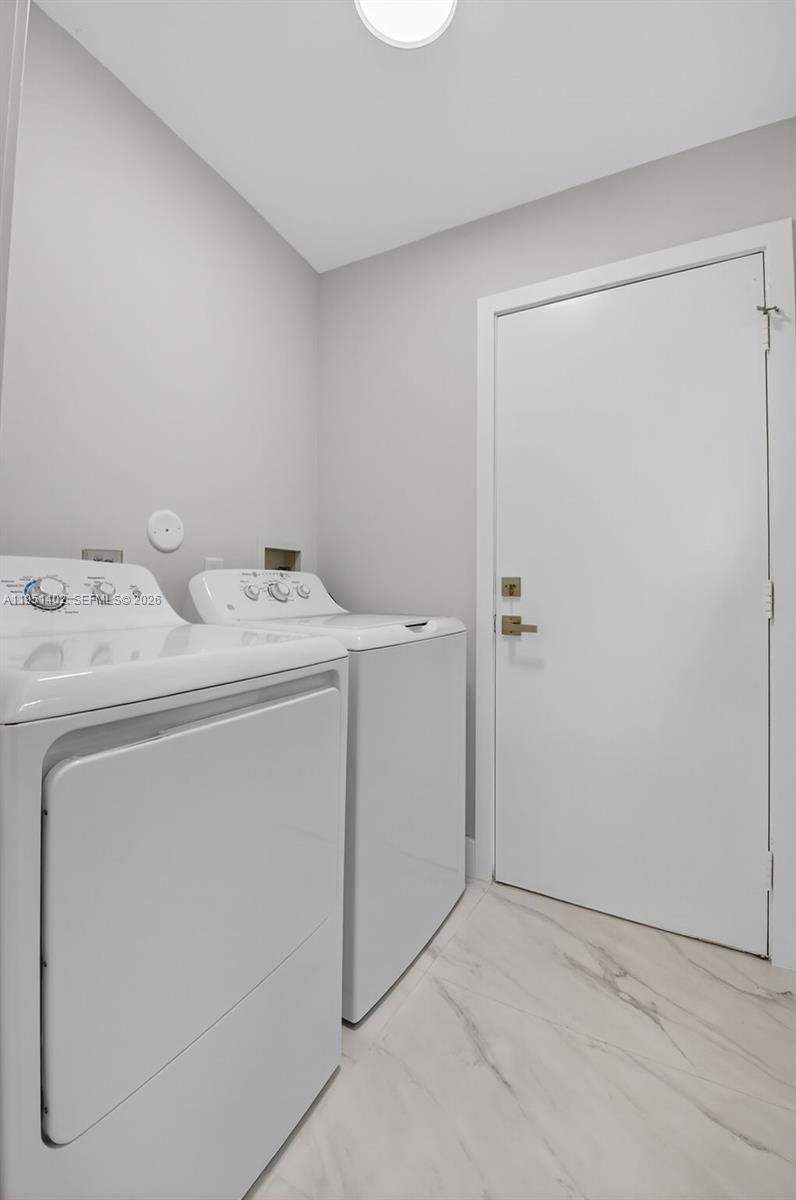 8127 Songbird Terrace Boca Raton, FL 33496 - Photo 19 of 65 a utility room with dryer and washer