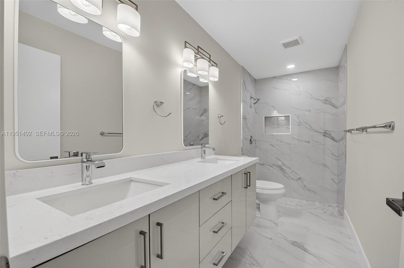 8127 Songbird Terrace Boca Raton, FL 33496 - Photo 24 of 65 a bathroom with a sink double vanity granite and a mirror