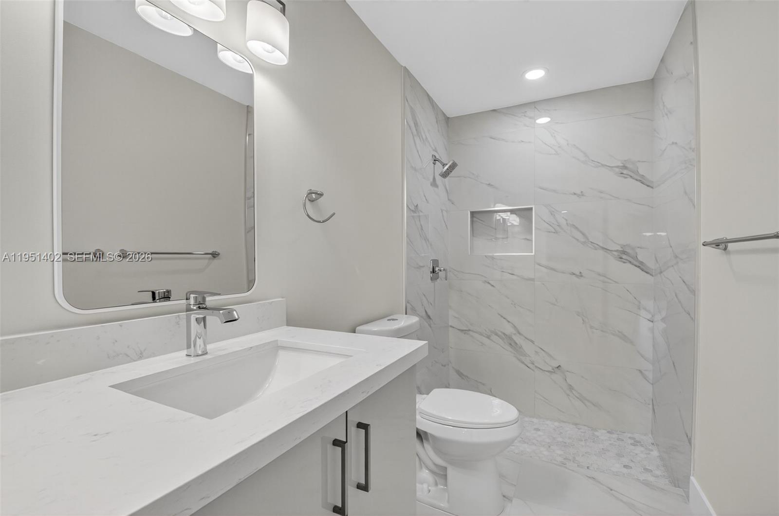 8127 Songbird Terrace Boca Raton, FL 33496 - Photo 25 of 65 a bathroom with a sink toilet and shower