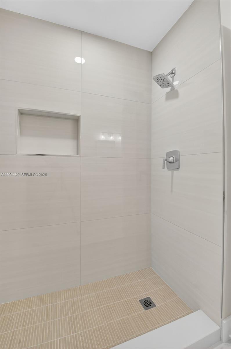 8127 Songbird Terrace Boca Raton, FL 33496 - Photo 28 of 65 a bathroom with a shower