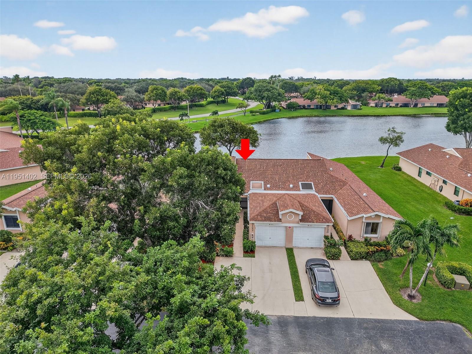 8127 Songbird Terrace Boca Raton, FL 33496 - Photo 37 of 65 an aerial view of a house with a lake view