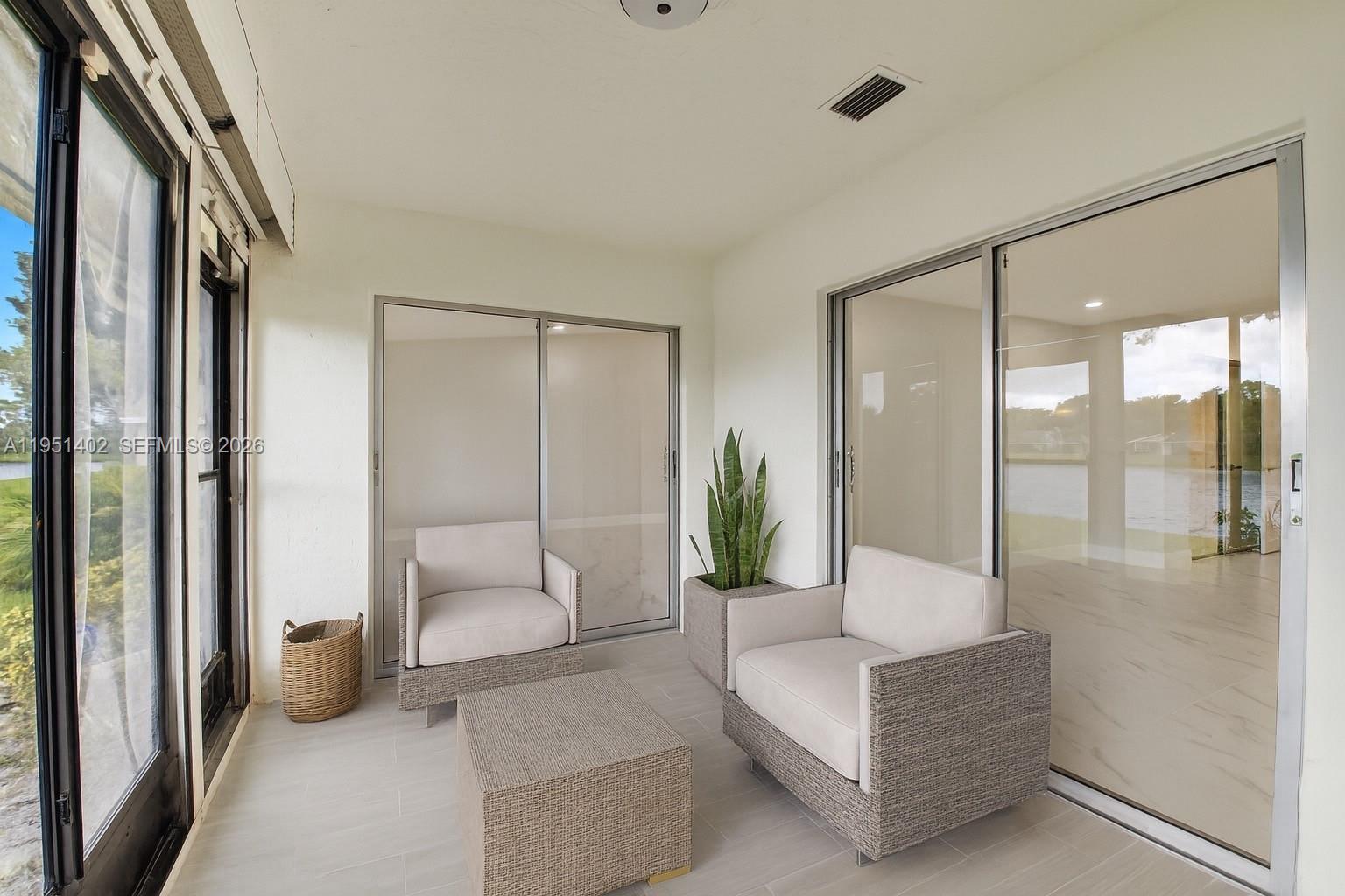 8127 Songbird Terrace Boca Raton, FL 33496 - Photo 4 of 65 a living room with furniture and a floor to ceiling window