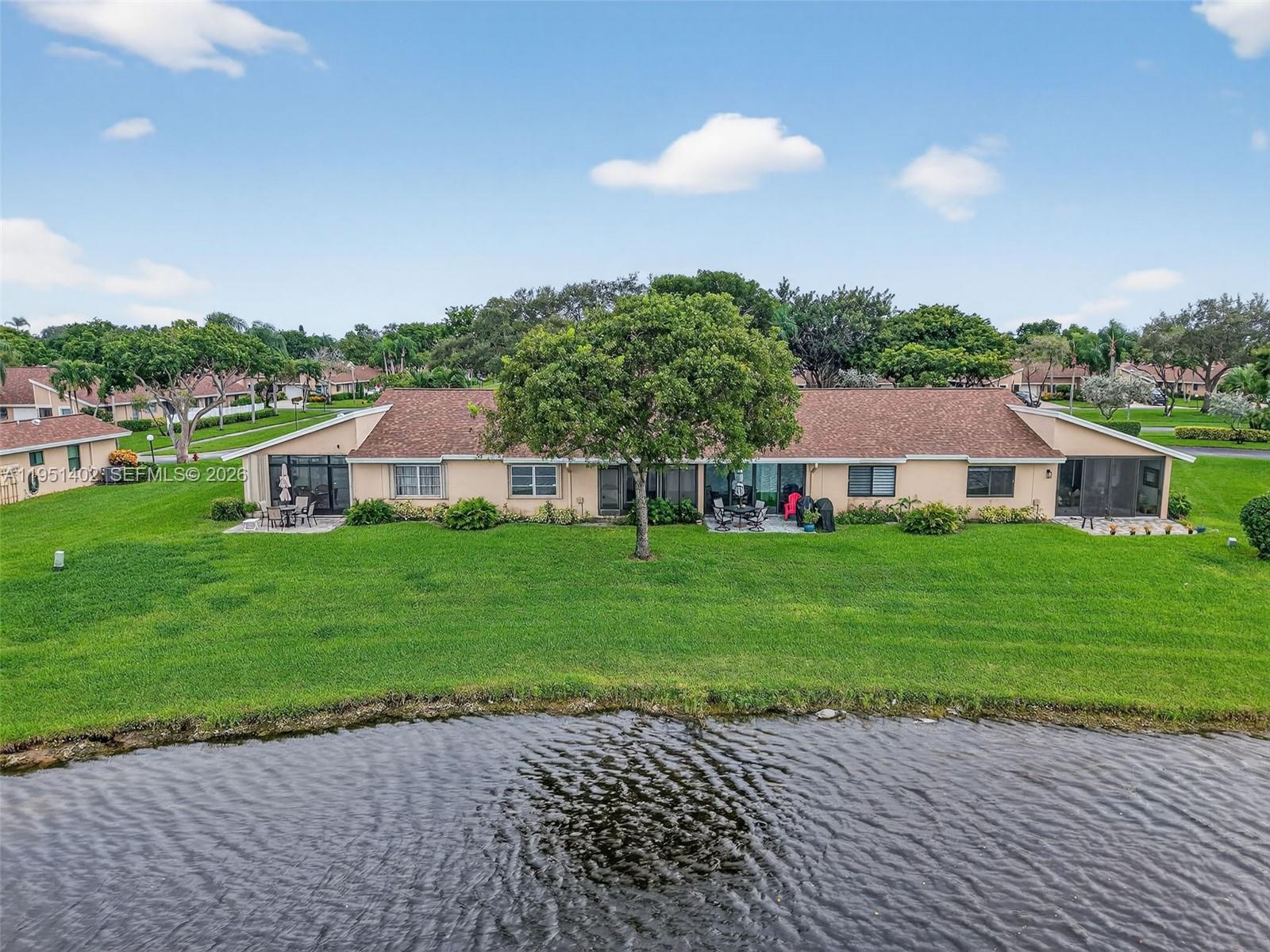 8127 Songbird Terrace Boca Raton, FL 33496 - Photo 41 of 65 a front view of a house with garden