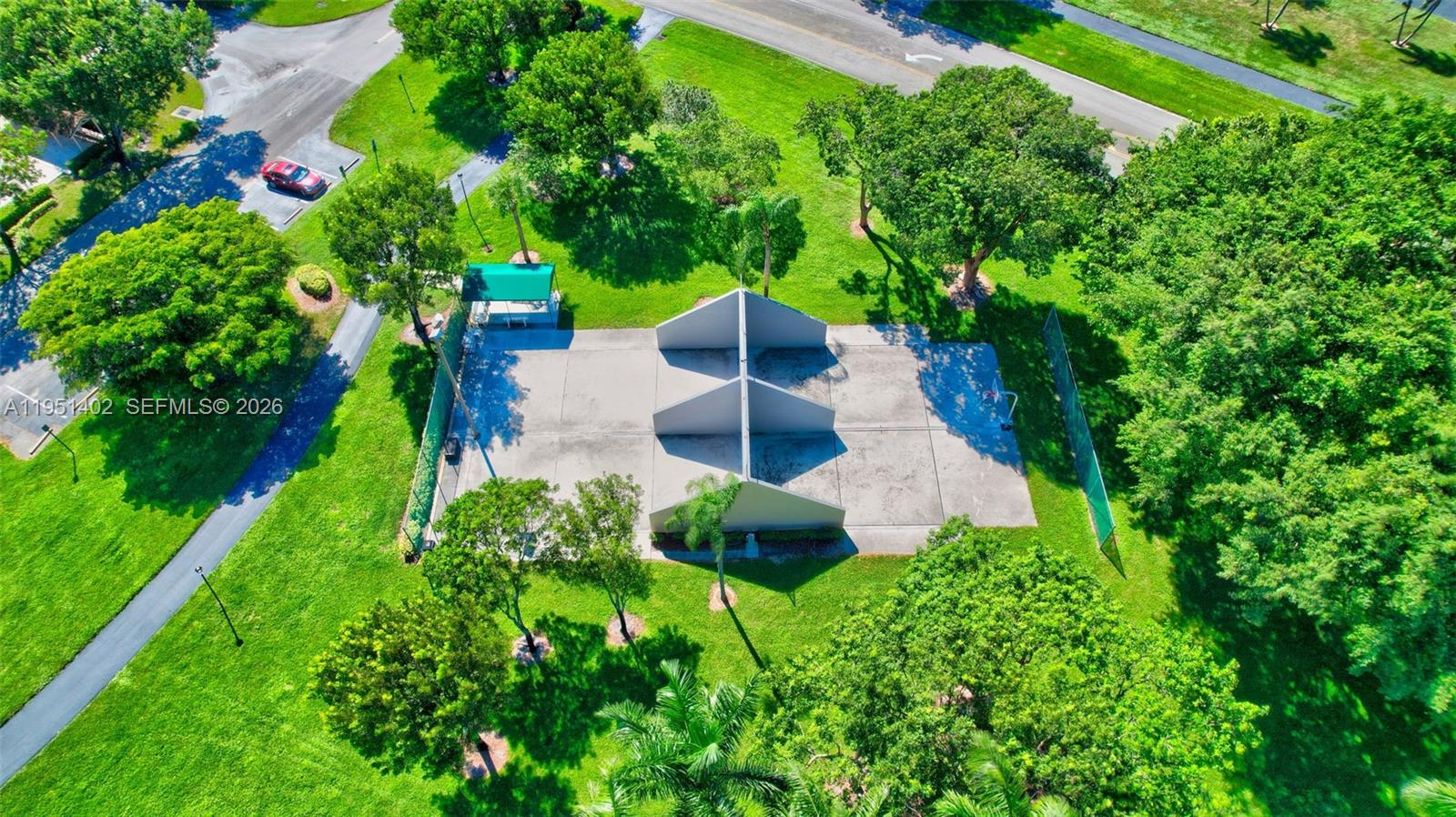 8127 Songbird Terrace Boca Raton, FL 33496 - Photo 48 of 65 a view of yard plants and large trees