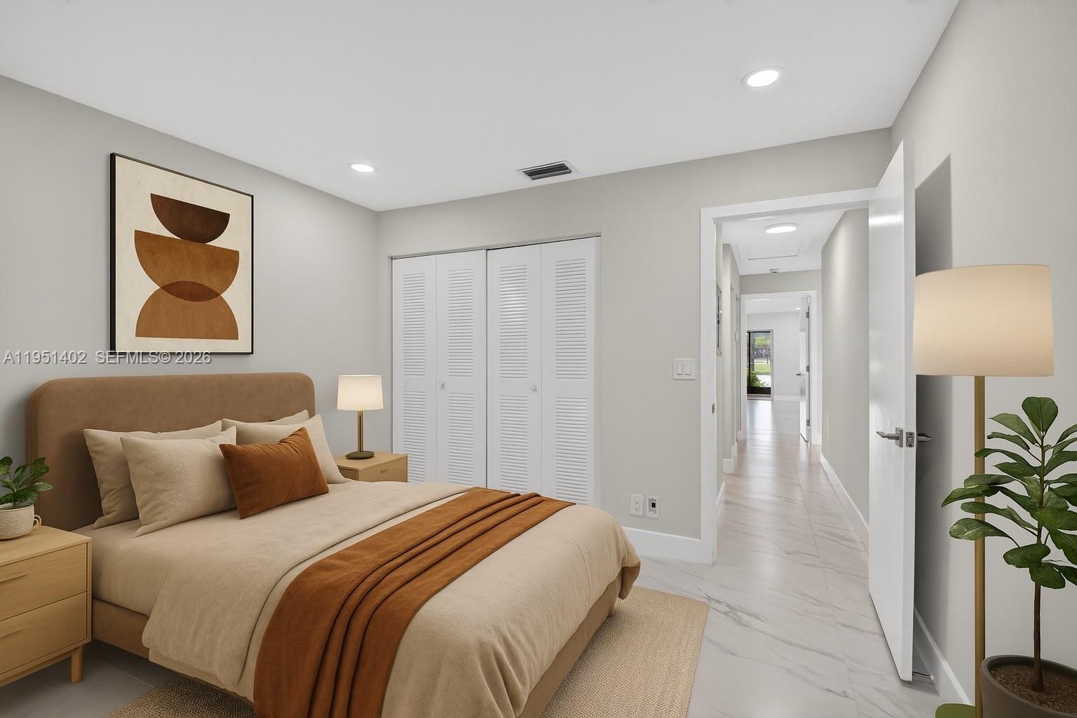 8127 Songbird Terrace Boca Raton, FL 33496 - Photo 5 of 65 a spacious bedroom with a bed and painting on the wall