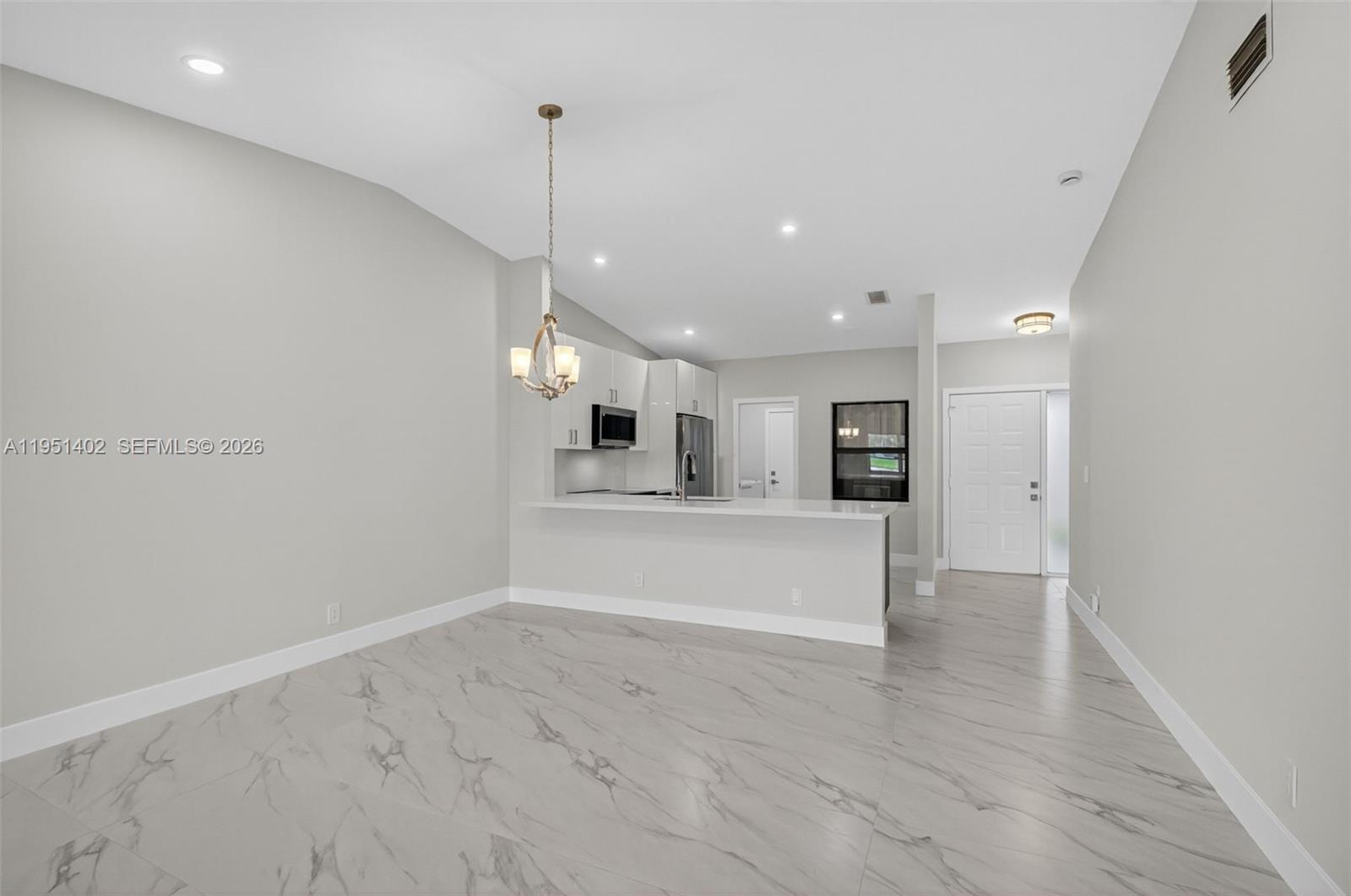 8127 Songbird Terrace Boca Raton, FL 33496 - Photo 9 of 65 a view of a kitchen with a sink and a window
