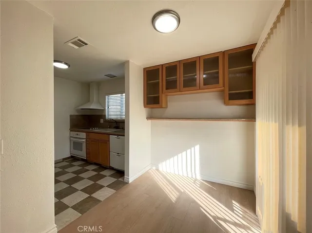 a kitchen with granite countertop a refrigerator and a stove