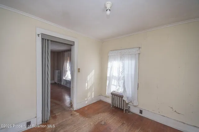 wooden floor and windows in an empty room