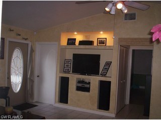 8056 Pelican Road Fort Myers, FL 33967 - Photo 3 of 5 a view of living room with furniture and flat screen tv