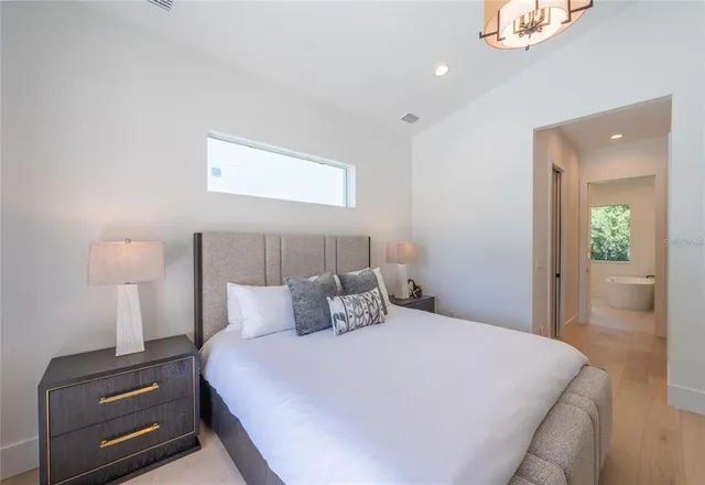 a bath room with a sink and a mirror