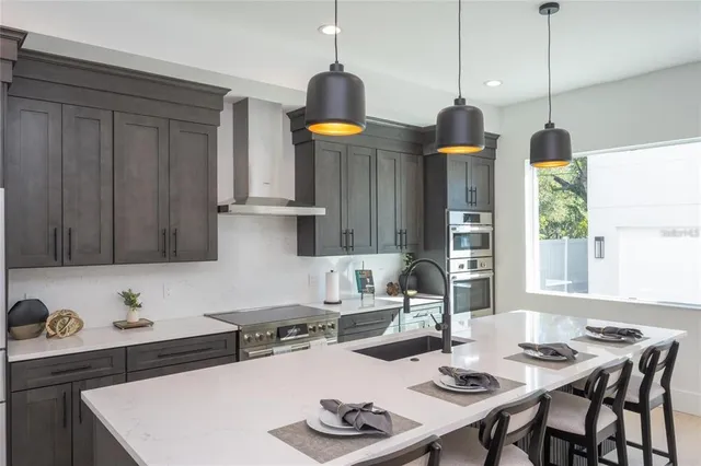 a kitchen with a table chairs and a stove